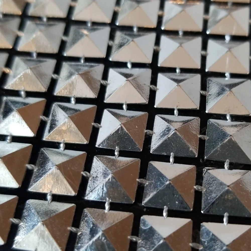 Modern studded wall mirror
